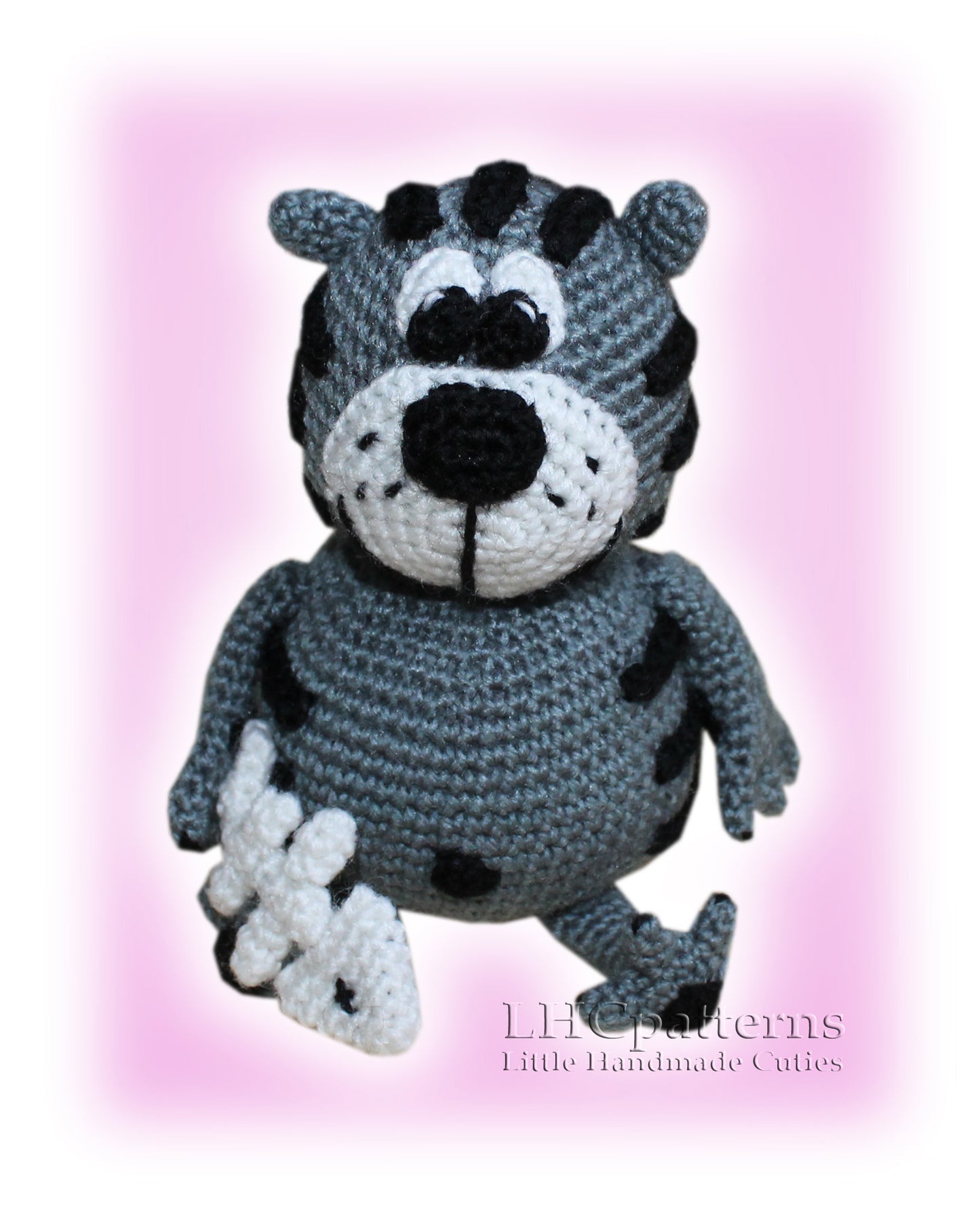 crochet cat with a fish bone