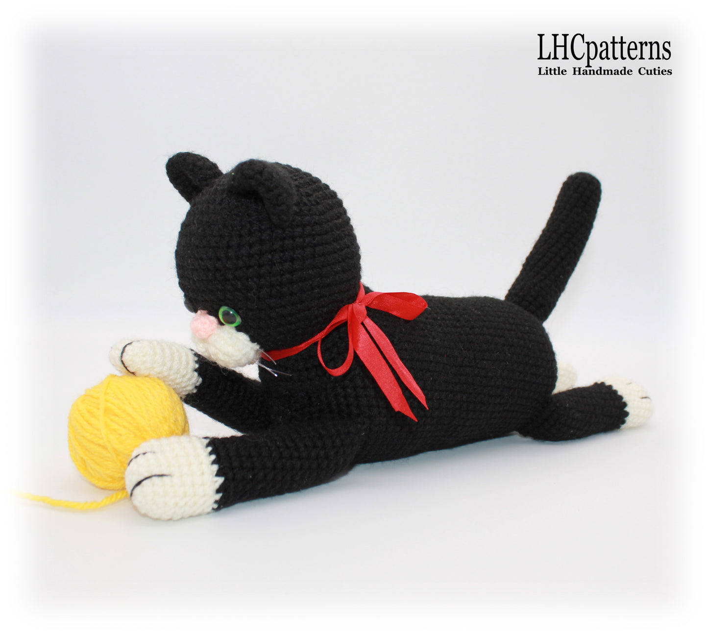 crochet black laying cat