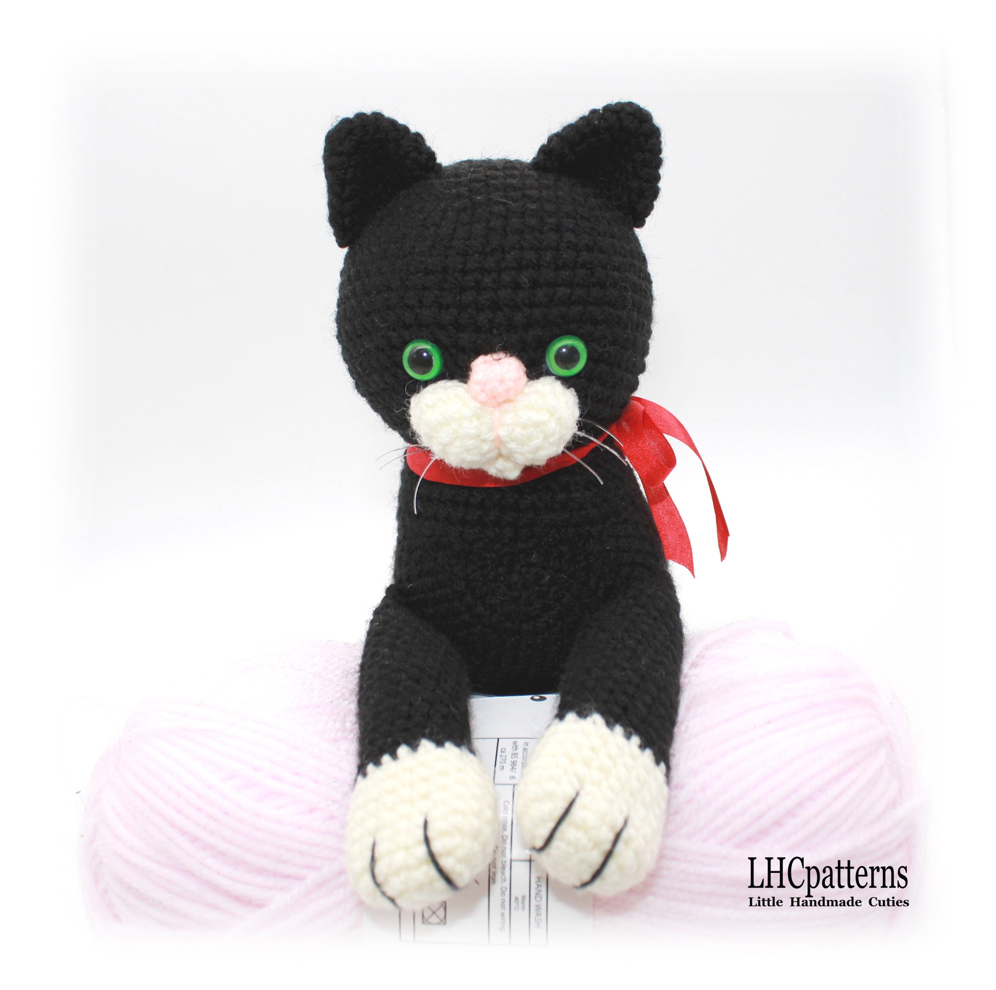 crochet black laying cat