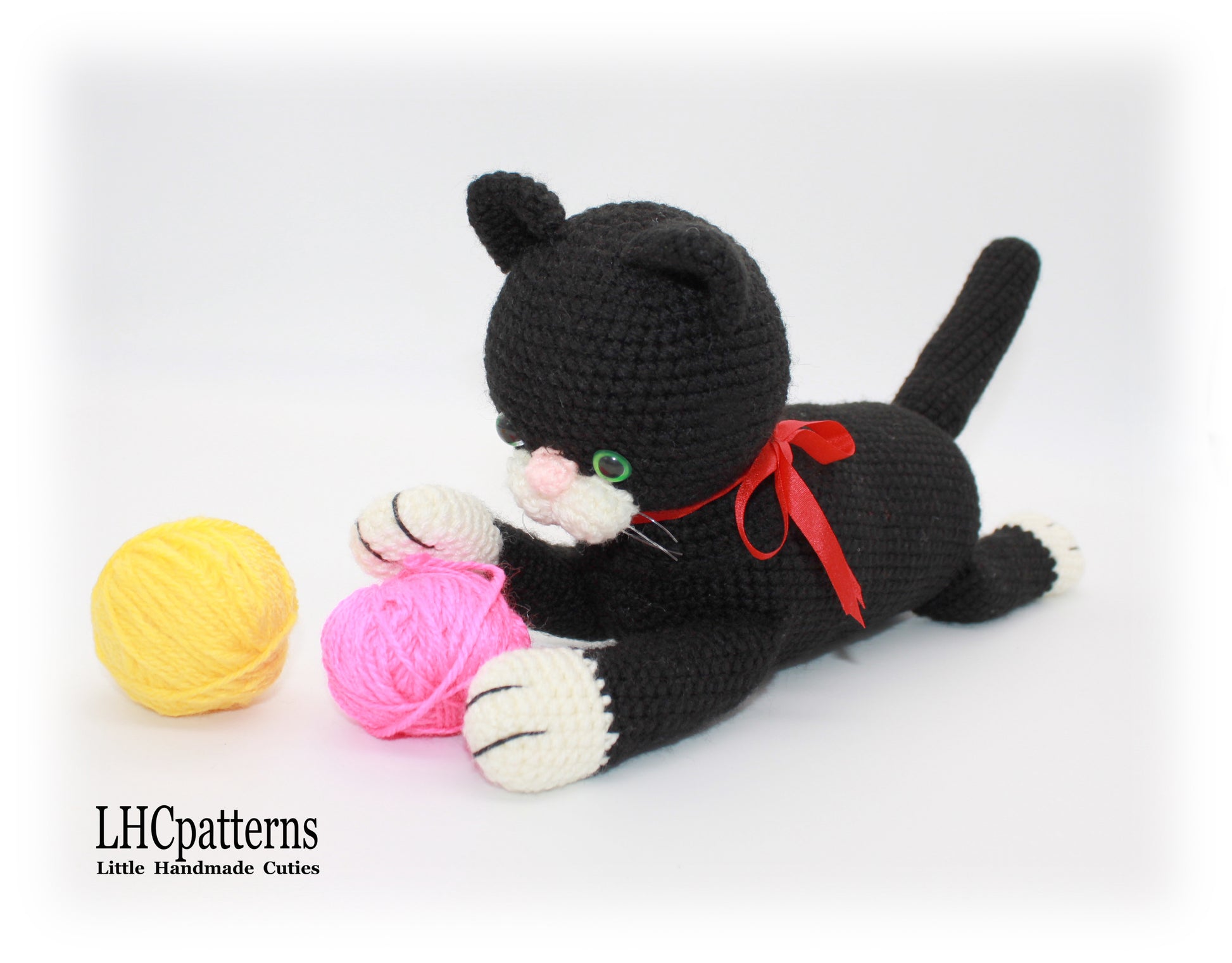 crochet black laying cat