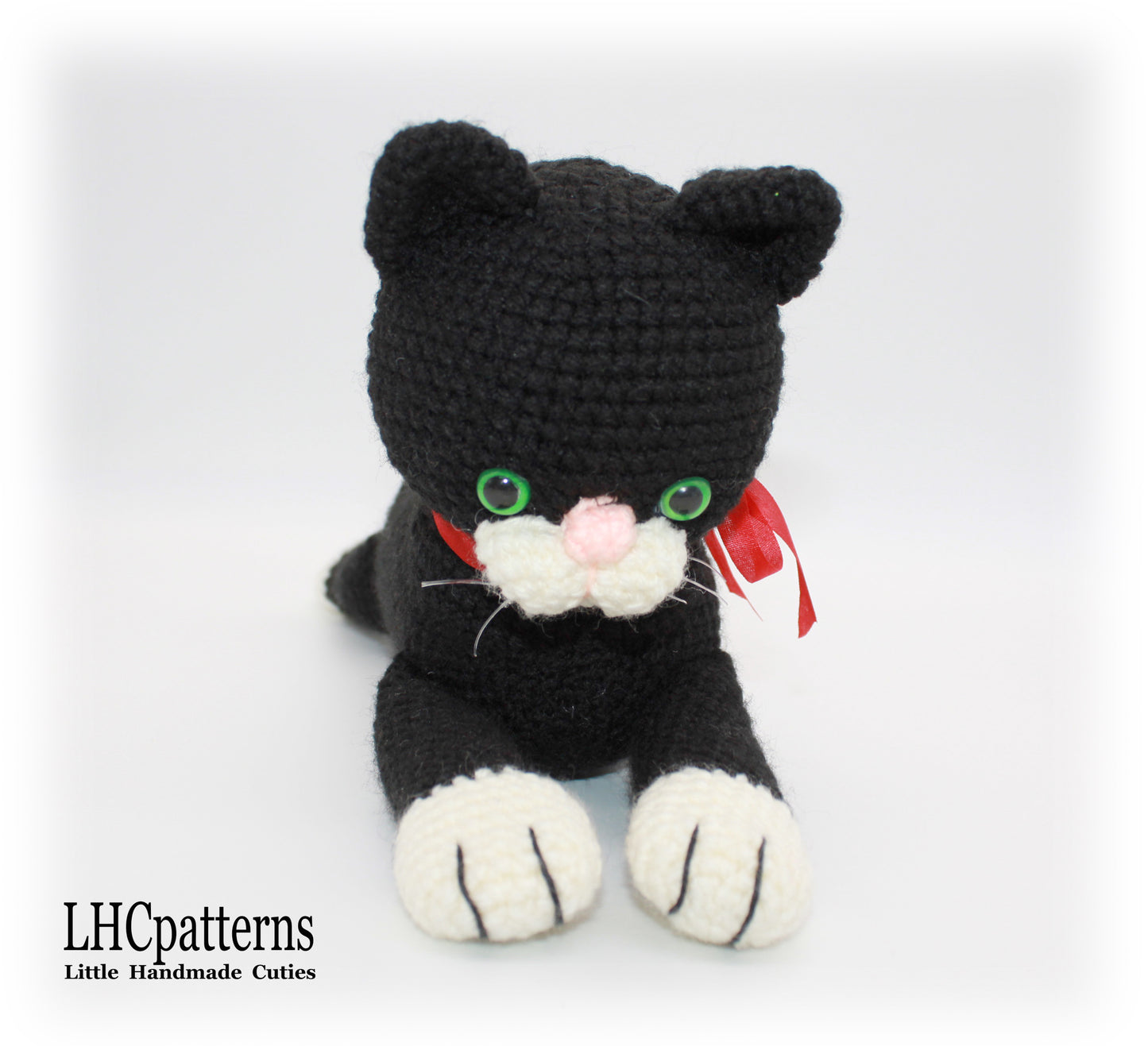 crochet black laying cat