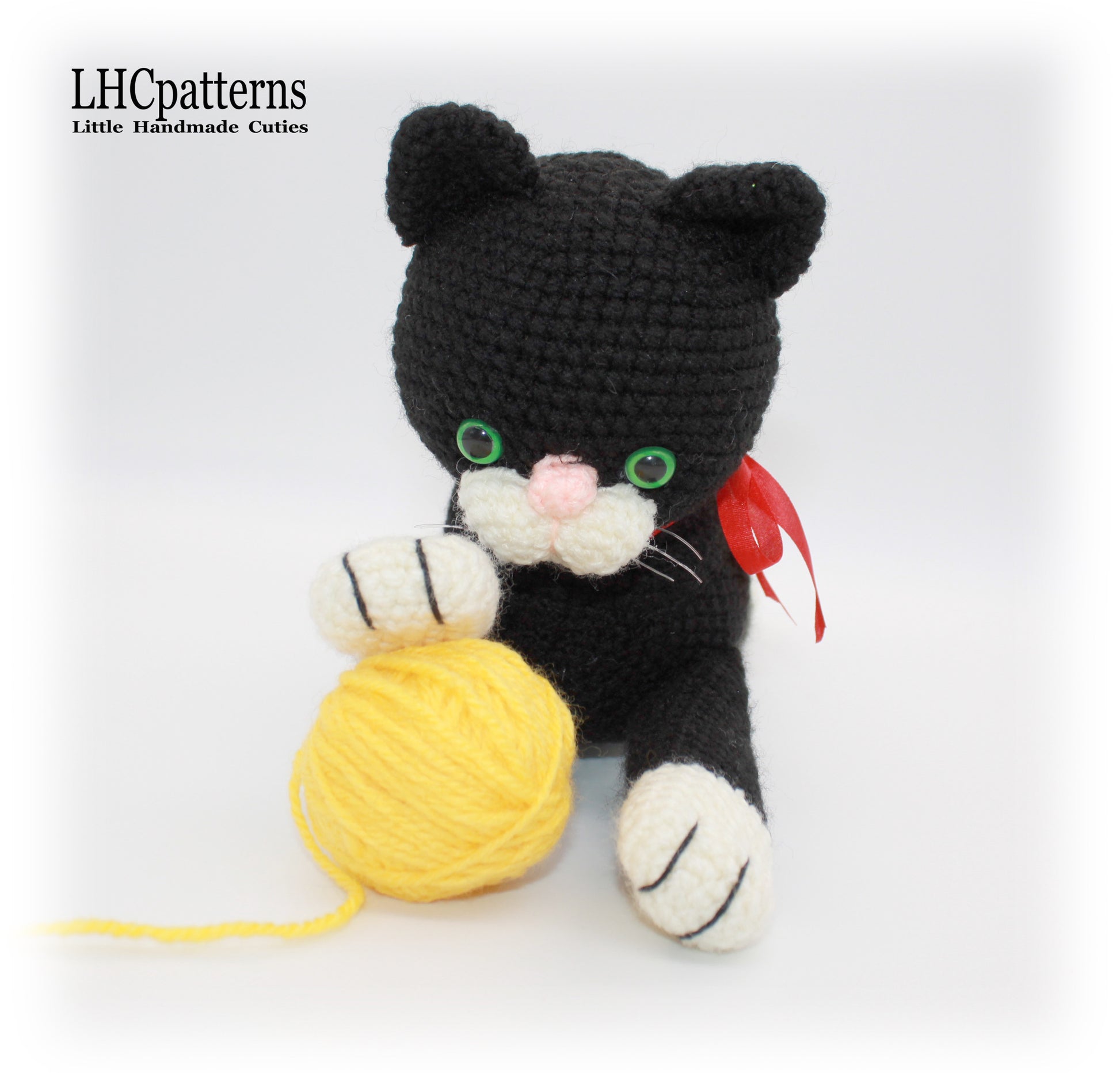 crochet black laying cat