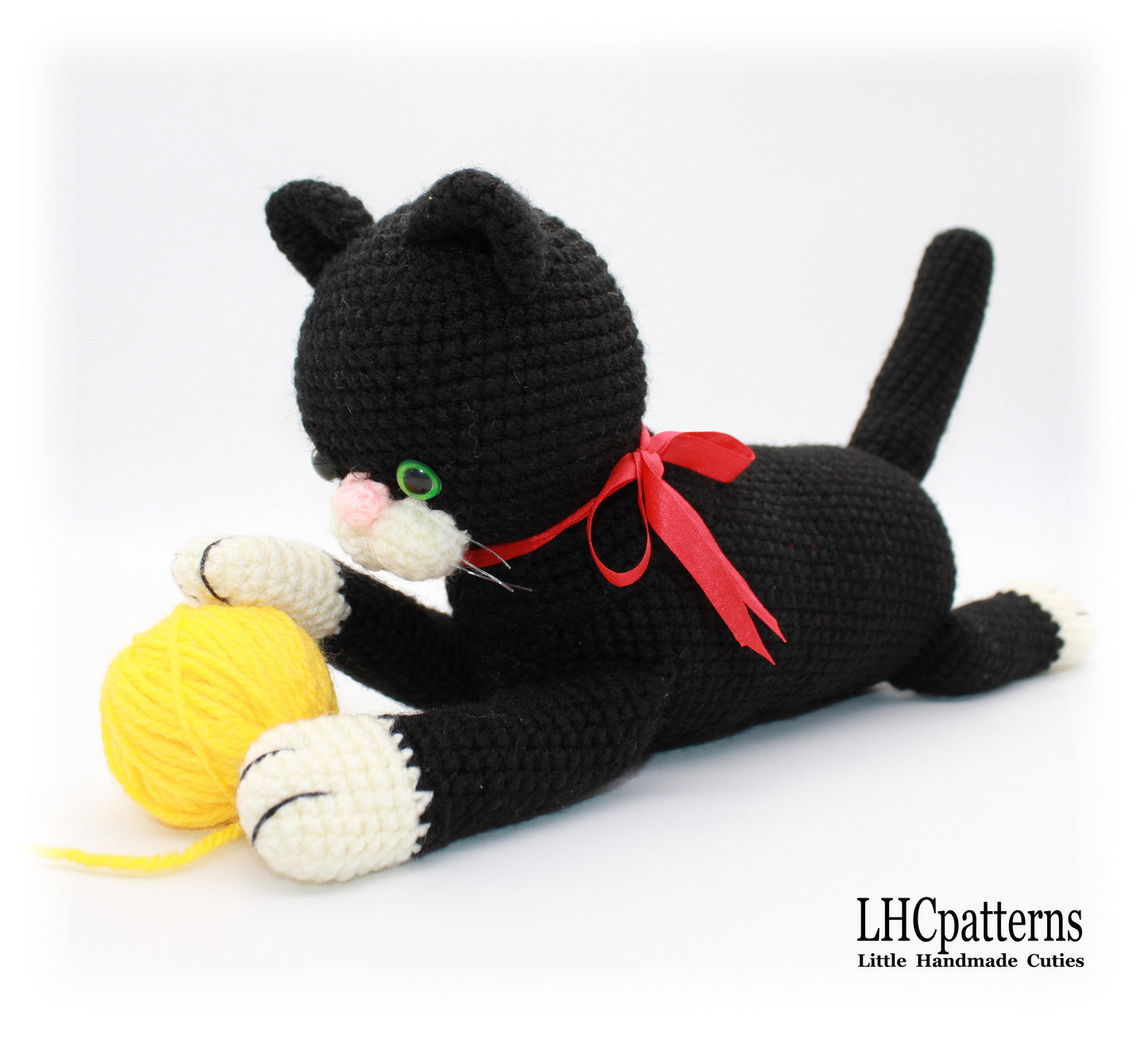 crochet black laying cat