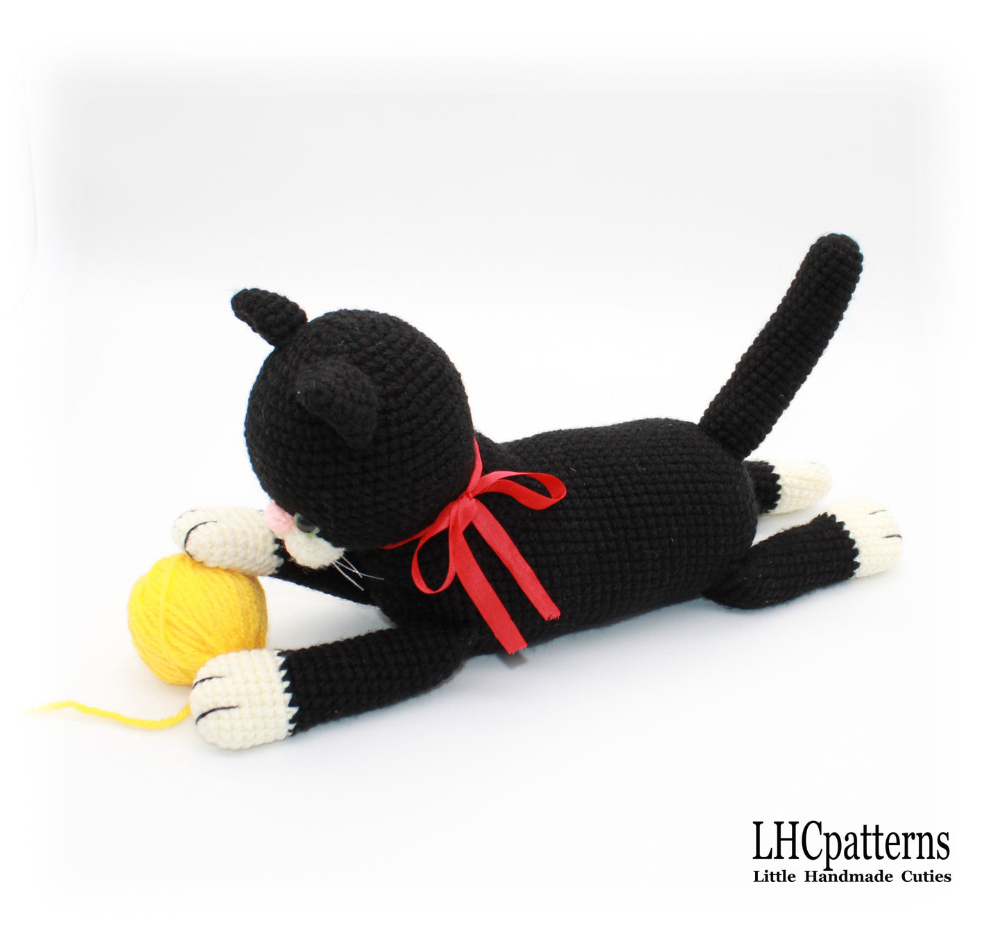 crochet black laying cat