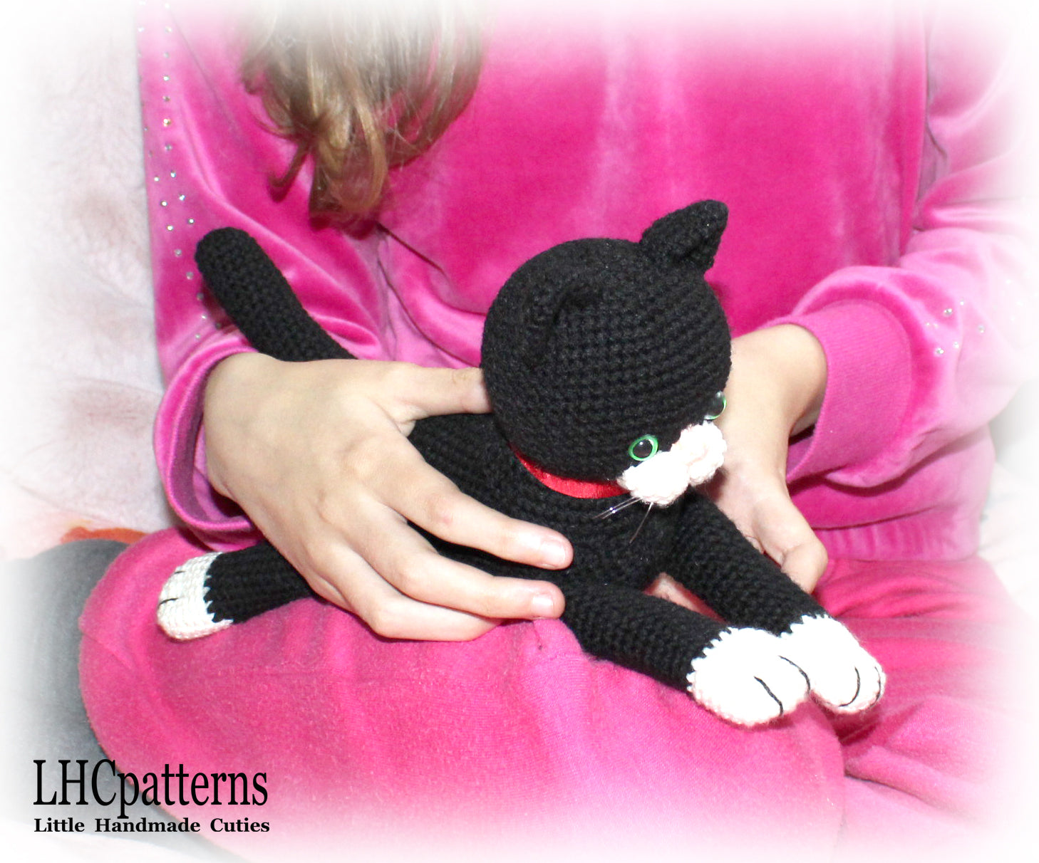 crochet black laying cat