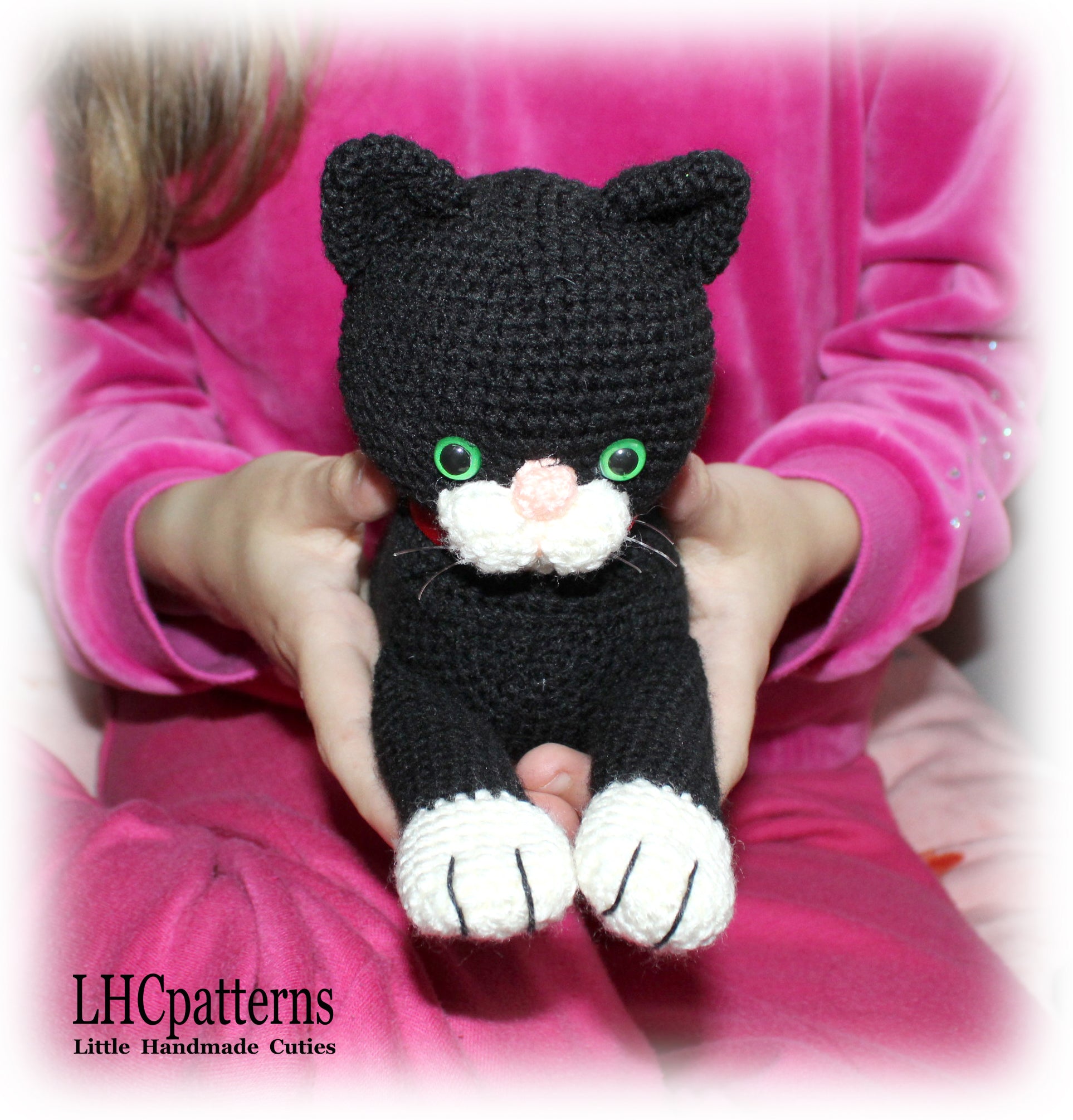 crochet black laying cat